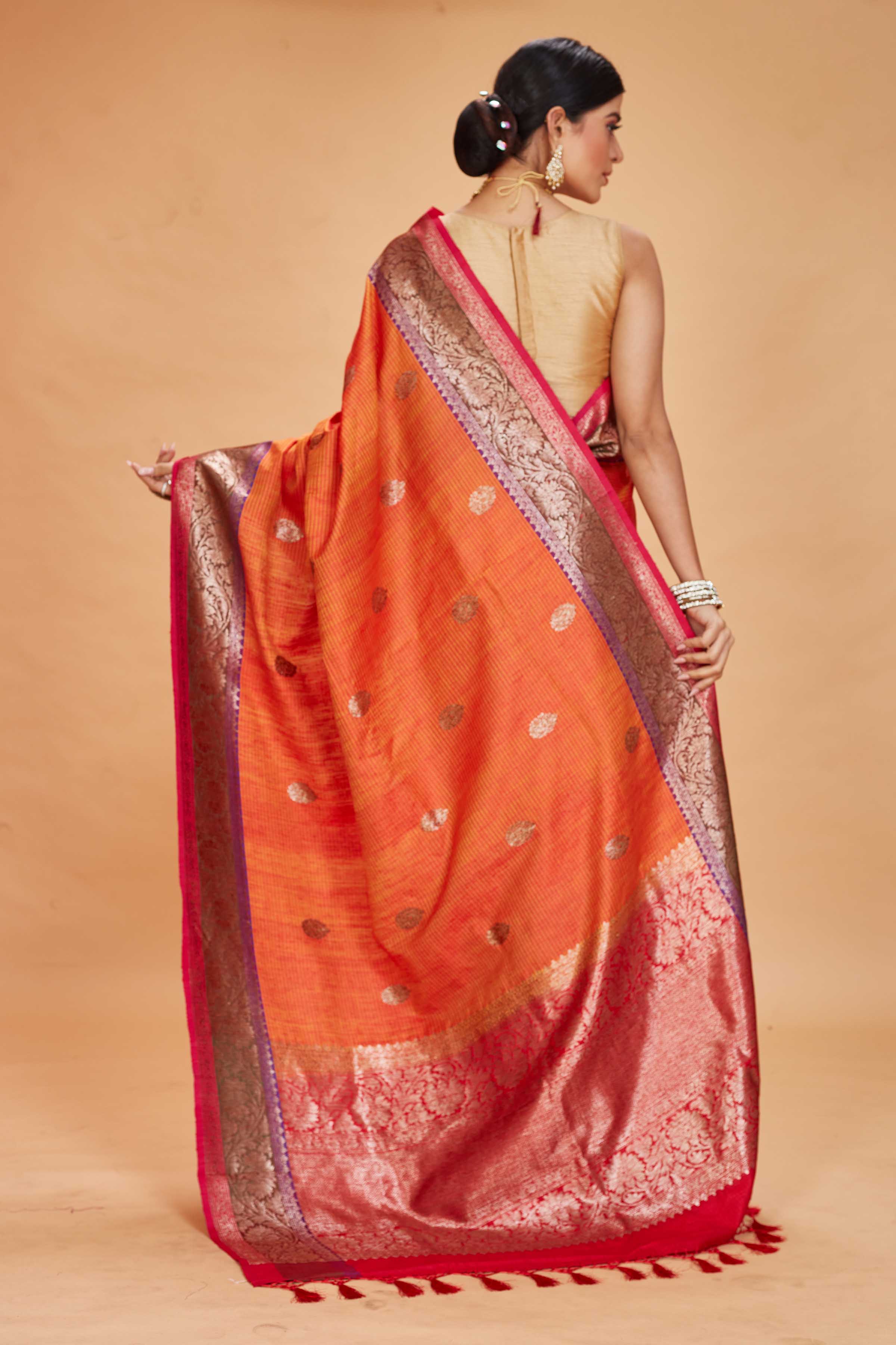 Buy orange tussar Banarasi sari online in USA with purple magenta zari border. Look your best on festive occasions in latest designer saris, pure silk sarees, Kanjivaram silk sarees, handwoven saris, tussar silk sarees, embroidered saris from Pure Elegance Indian clothing store in USA.-back
