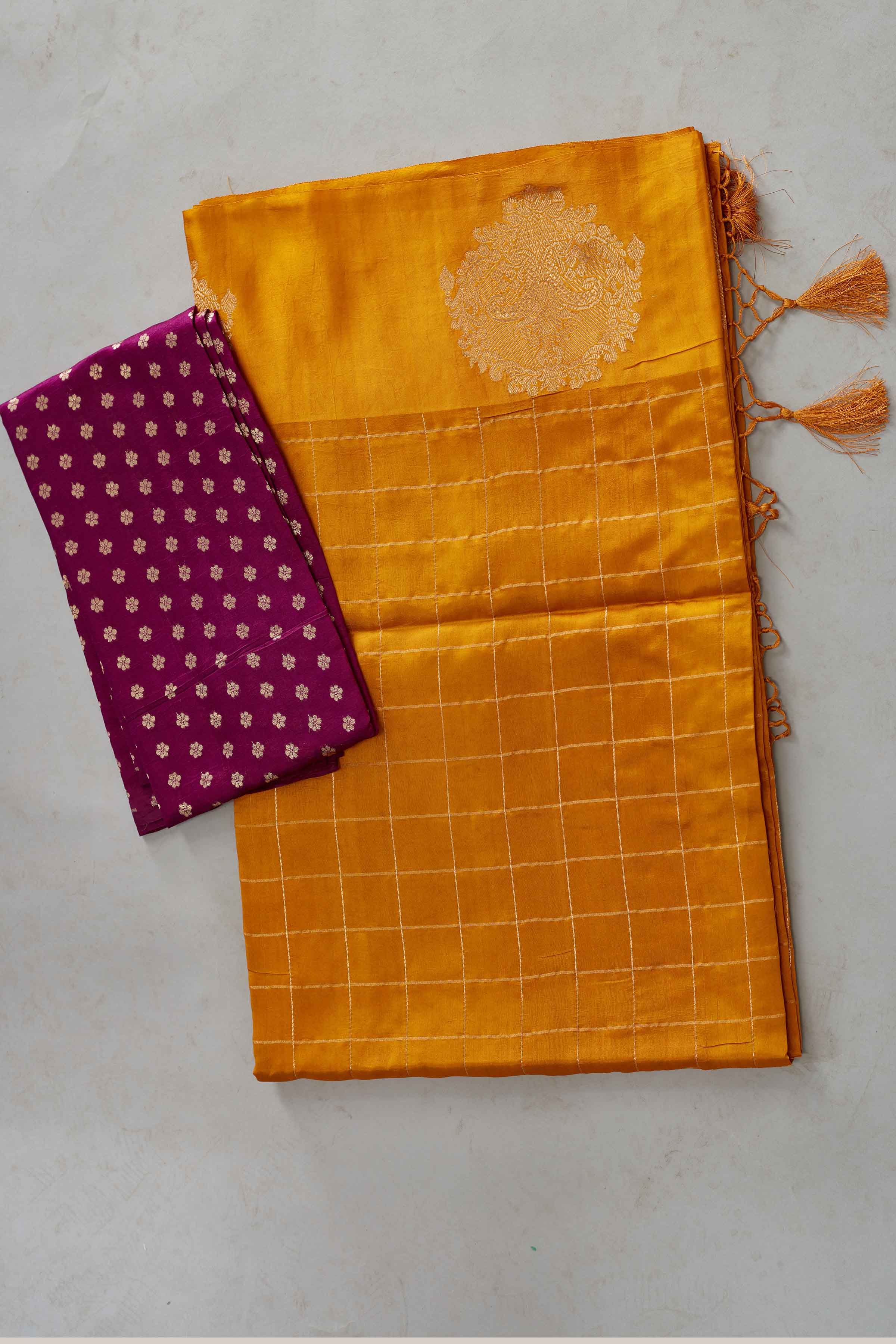 Shop yellow check silk Banarasi saree online in USA with zari motifs border. Look your best on festive occasions in latest designer sarees, pure silk sarees, Kanjivaram silk saris, handwoven saris, tussar silk sarees, embroidered saris from Pure Elegance Indian clothing store in USA.-blouse