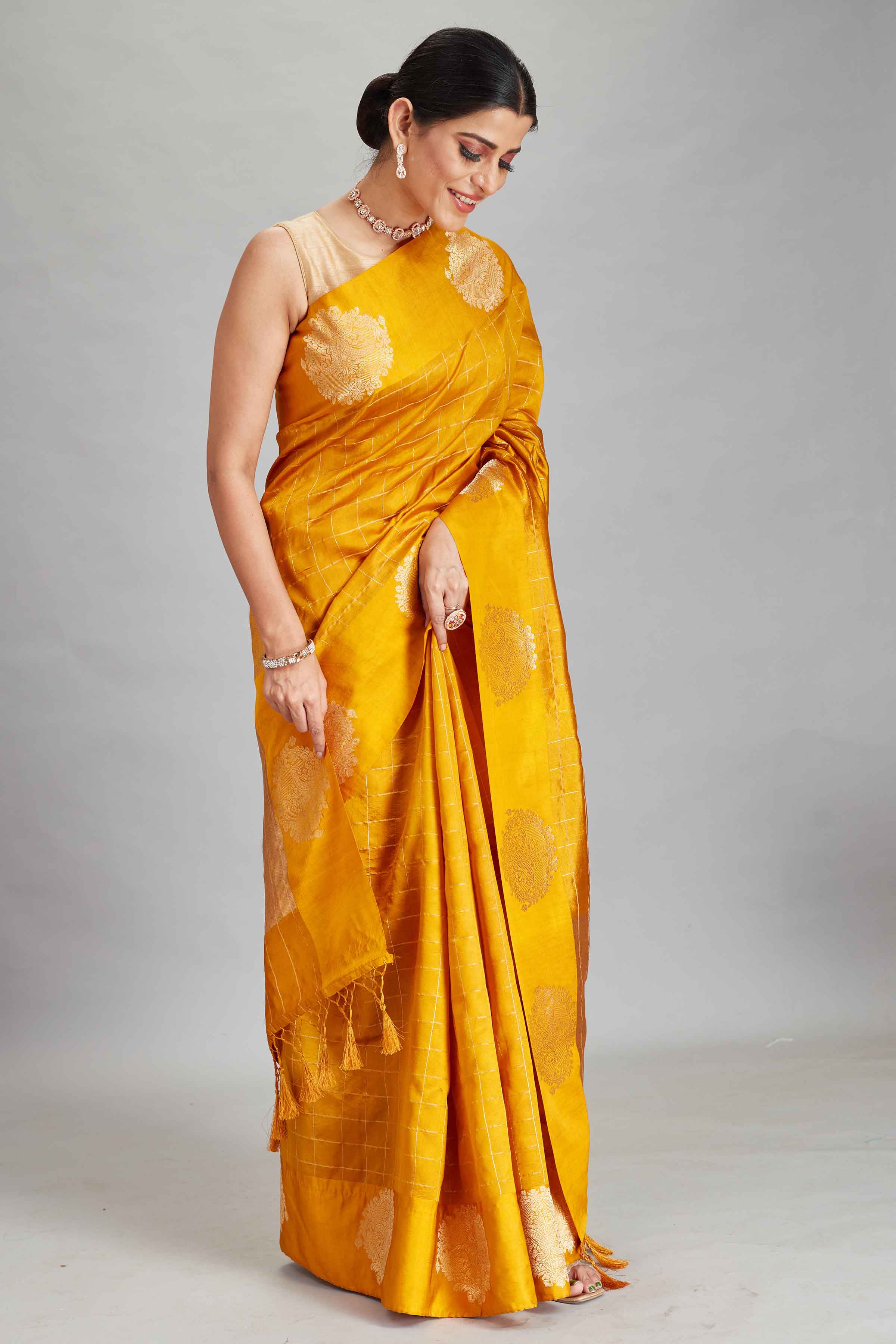 Shop yellow check silk Banarasi saree online in USA with zari motifs border. Look your best on festive occasions in latest designer sarees, pure silk sarees, Kanjivaram silk saris, handwoven saris, tussar silk sarees, embroidered saris from Pure Elegance Indian clothing store in USA.-side