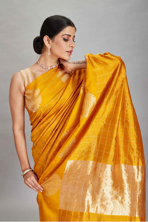 Shop yellow check silk Banarasi saree online in USA with zari motifs border. Look your best on festive occasions in latest designer sarees, pure silk sarees, Kanjivaram silk saris, handwoven saris, tussar silk sarees, embroidered saris from Pure Elegance Indian clothing store in USA.-closeup
