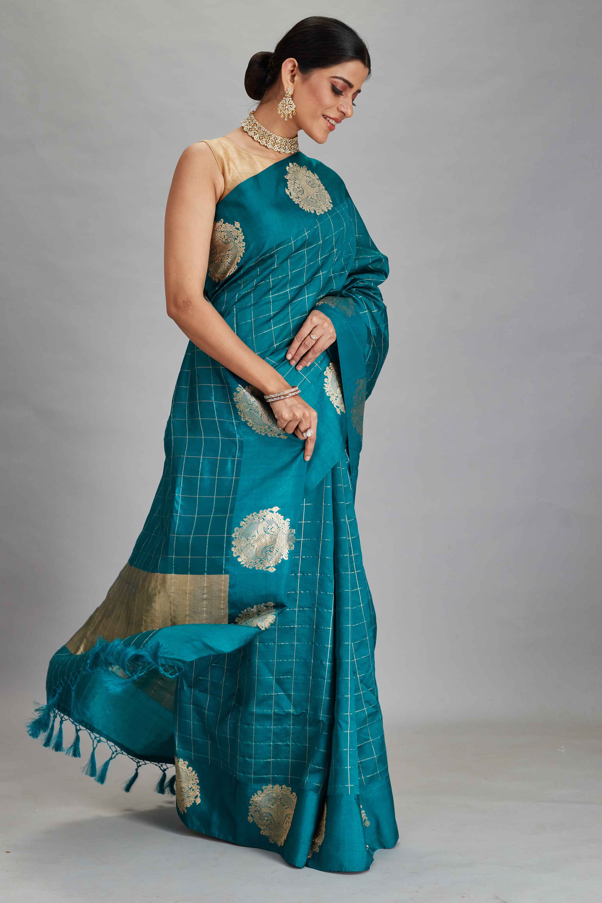 Buy beautiful sea green check silk Banarasi saree online in USA with zari motifs border. Look your best on festive occasions in latest designer sarees, pure silk sarees, Kanjivaram silk saris, handwoven saris, tussar silk sarees, embroidered saris from Pure Elegance Indian clothing store in USA.-side