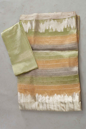 Buy green and peach striped tissue Banarasi saree online in USA. Look your best on festive occasions in latest designer sarees, pure silk sarees, Kanjivaram silk saris, handwoven saris, tussar silk sarees, embroidered saris from Pure Elegance Indian clothing store in USA.-blouse