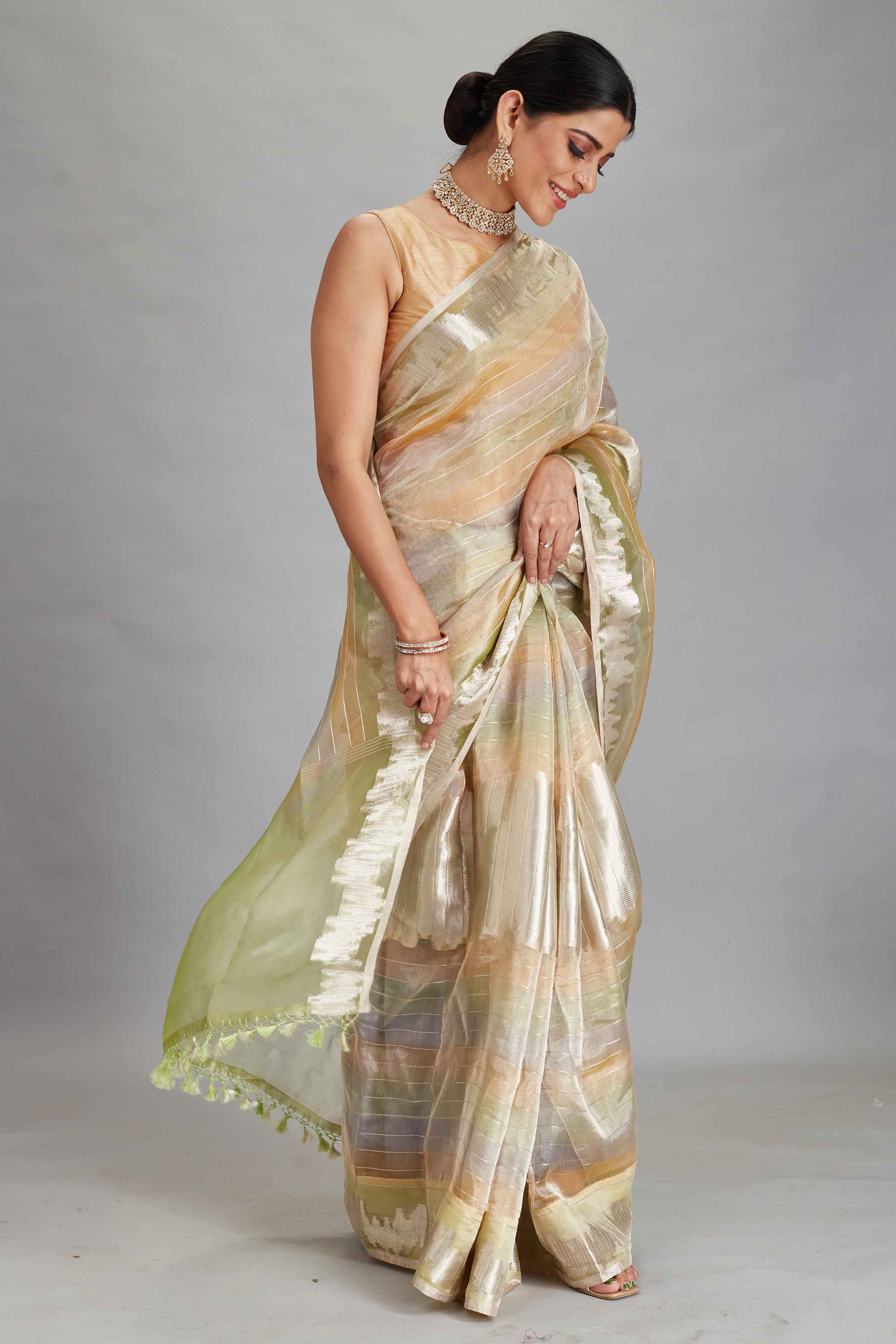 Buy green and peach striped tissue Banarasi saree online in USA. Look your best on festive occasions in latest designer sarees, pure silk sarees, Kanjivaram silk saris, handwoven saris, tussar silk sarees, embroidered saris from Pure Elegance Indian clothing store in USA.-side