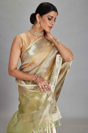 Buy green and peach striped tissue Banarasi saree online in USA. Look your best on festive occasions in latest designer sarees, pure silk sarees, Kanjivaram silk saris, handwoven saris, tussar silk sarees, embroidered saris from Pure Elegance Indian clothing store in USA.-closeup