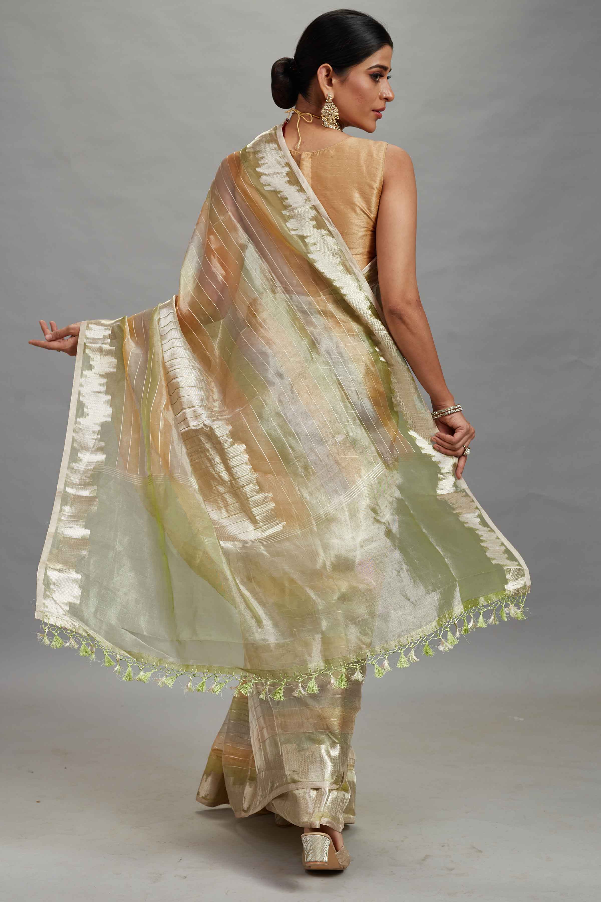 Buy green and peach striped tissue Banarasi saree online in USA. Look your best on festive occasions in latest designer sarees, pure silk sarees, Kanjivaram silk saris, handwoven saris, tussar silk sarees, embroidered saris from Pure Elegance Indian clothing store in USA.-back