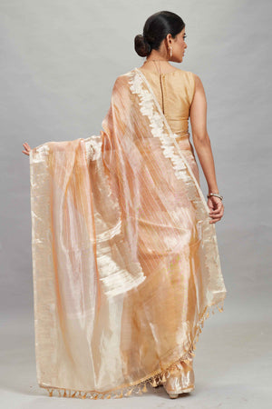 Shop peach and silver striped tissue Banarasi saree online in USA. Look your best on festive occasions in latest designer sarees, pure silk sarees, Kanjivaram silk saris, handwoven saris, tussar silk sarees, embroidered saris from Pure Elegance Indian clothing store in USA.-back