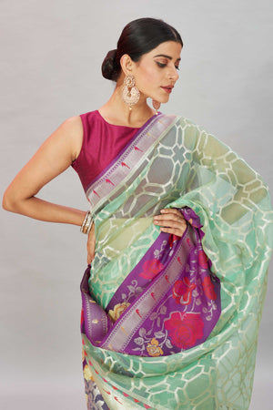 Buy pastel green Kora Banarasi sari online in USA with overall zari jaal. Look your best on festive occasions in latest designer sarees, pure silk sarees, Kanjivaram silk saris, handwoven saris, tussar silk sarees, embroidered saris from Pure Elegance Indian clothing store in USA.-closeup