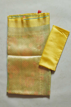 Shop yellow Kora Banarasi sari online in USA with floral zari jaal. Look your best on festive occasions in latest designer sarees, pure silk sarees, Kanjivaram silk saris, handwoven saris, tussar silk sarees, embroidered saris from Pure Elegance Indian clothing store in USA.-blouse