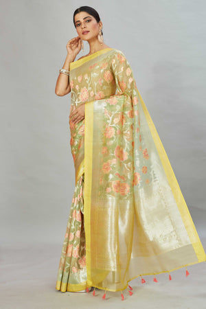 Shop yellow Kora Banarasi sari online in USA with floral zari jaal. Look your best on festive occasions in latest designer sarees, pure silk sarees, Kanjivaram silk saris, handwoven saris, tussar silk sarees, embroidered saris from Pure Elegance Indian clothing store in USA.-pallu