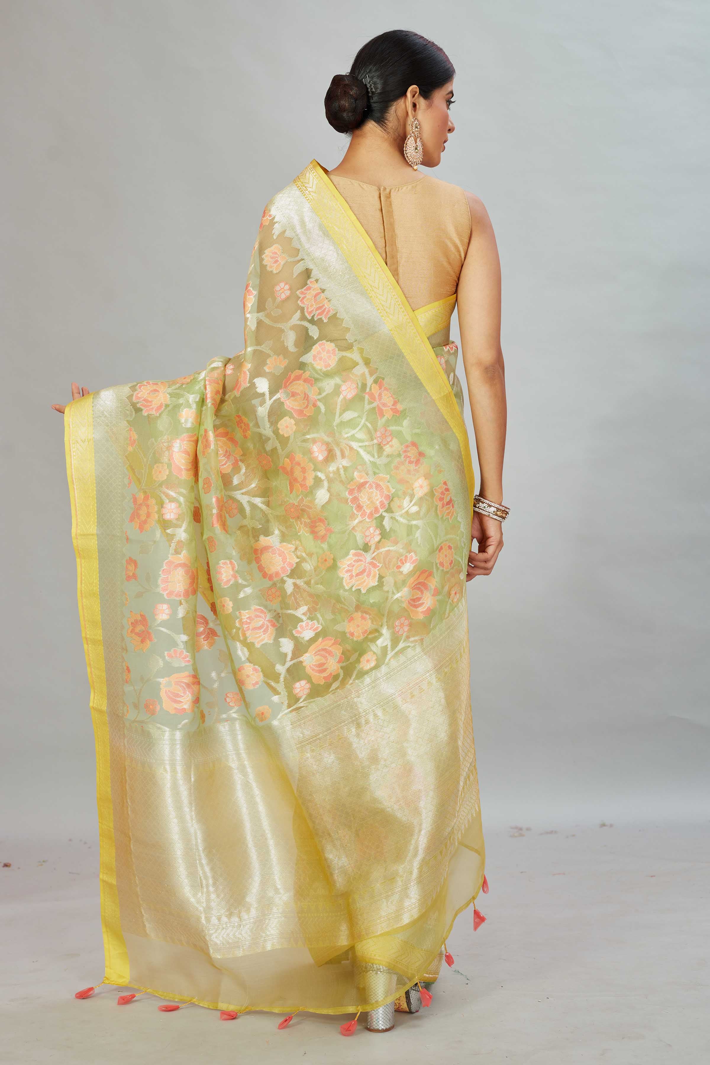 Shop yellow Kora Banarasi sari online in USA with floral zari jaal. Look your best on festive occasions in latest designer sarees, pure silk sarees, Kanjivaram silk saris, handwoven saris, tussar silk sarees, embroidered saris from Pure Elegance Indian clothing store in USA.-back