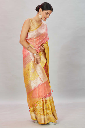 Buy stunning pink Kora Banarasi sari online in USA with yellow border. Look your best on festive occasions in latest designer sarees, pure silk sarees, Kanjivaram silk saris, handwoven saris, tussar silk sarees, embroidered saris from Pure Elegance Indian clothing store in USA.-side
