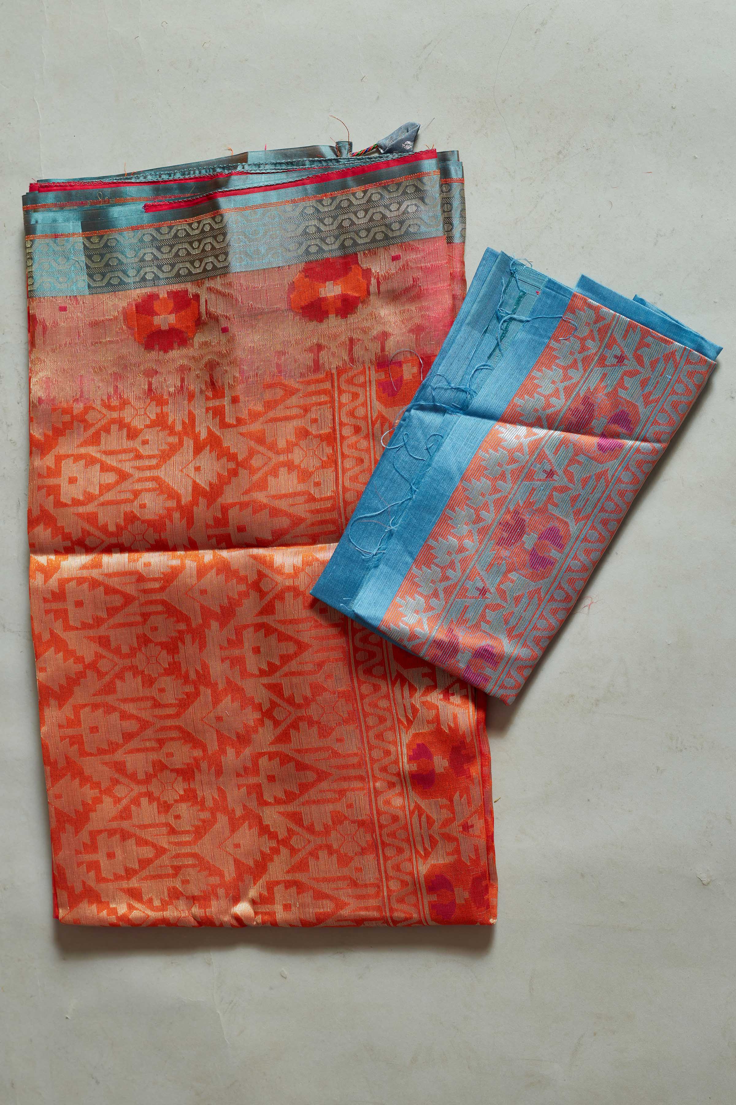 Shop pink and orange Kora Banarasi sari online in USA with blue border. Look your best on festive occasions in latest designer sarees, pure silk sarees, Kanjivaram silk saris, handwoven saris, tussar silk sarees, embroidered saris from Pure Elegance Indian clothing store in USA.-blouse