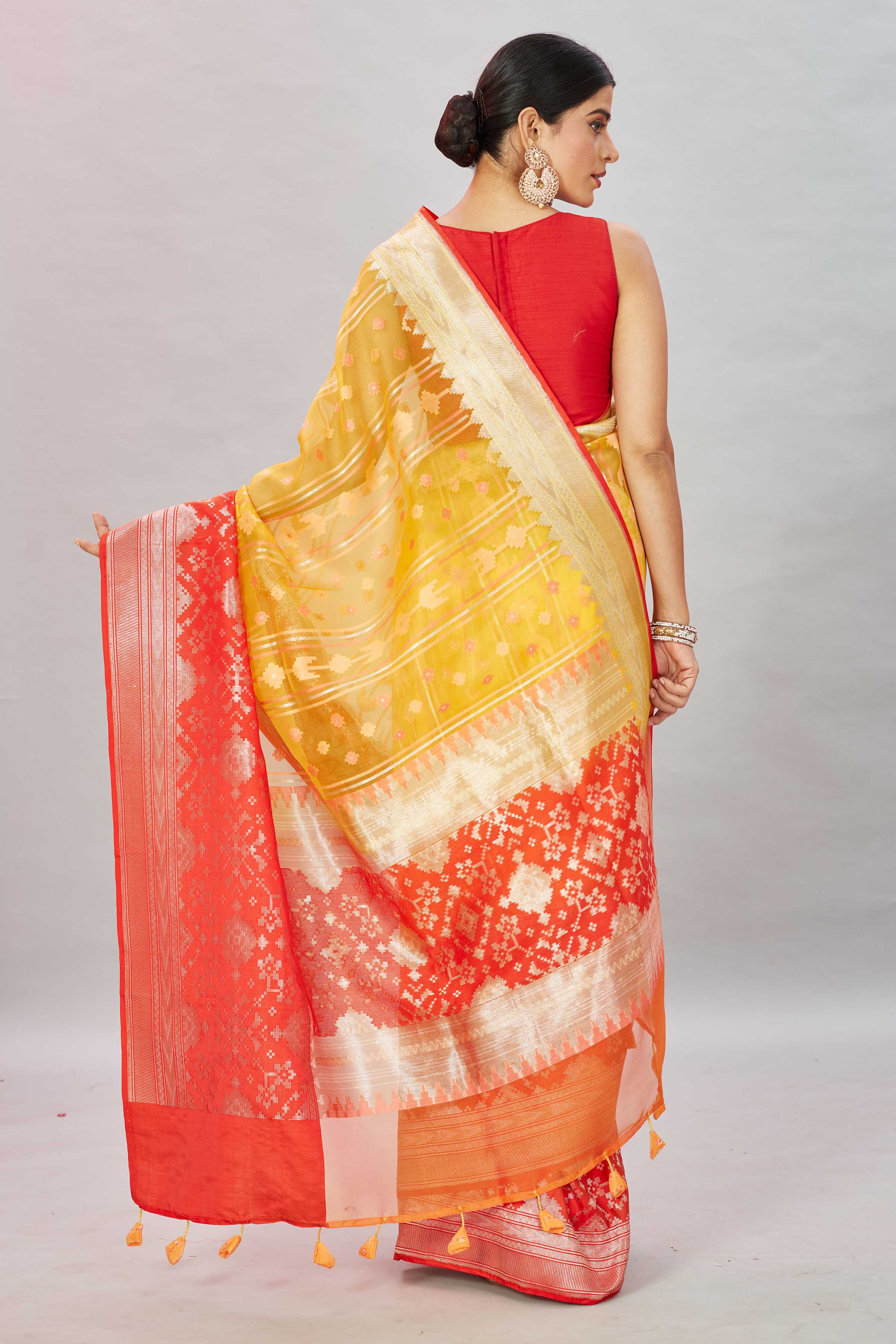Buy yellow Kora Banarasi sari online in USA with red zari border. Look your best on festive occasions in latest designer sarees, pure silk sarees, Kanjivaram silk saris, handwoven saris, tussar silk sarees, embroidered saris from Pure Elegance Indian clothing store in USA.-back