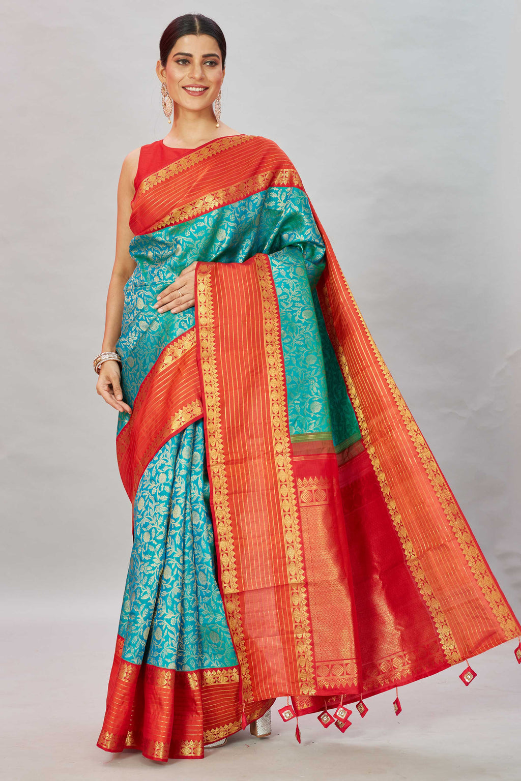 Buy sea green floral Kanjivaram silk saree online in USA with red zari stripes border. Look your best on festive occasions in latest designer sarees, pure silk sarees, Kanjivaram silk saris, handwoven saris, tussar silk sarees, embroidered saris from Pure Elegance Indian clothing store in USA.-full view