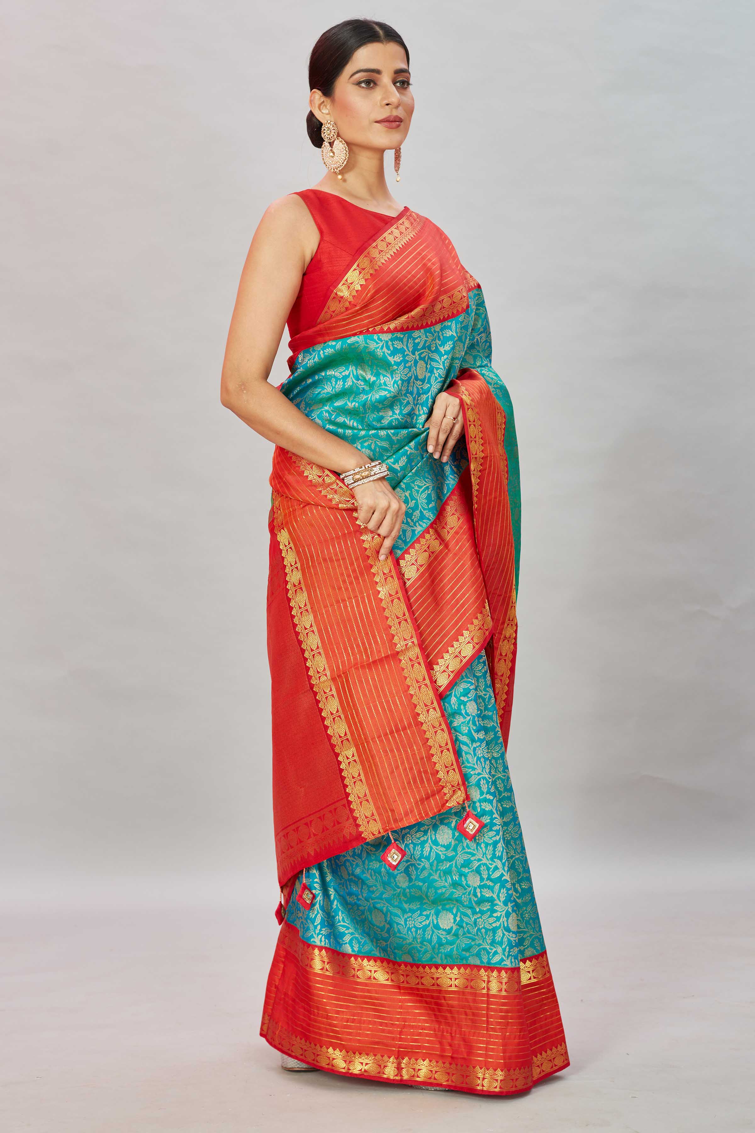 Buy sea green floral Kanjivaram silk saree online in USA with red zari stripes border. Look your best on festive occasions in latest designer sarees, pure silk sarees, Kanjivaram silk saris, handwoven saris, tussar silk sarees, embroidered saris from Pure Elegance Indian clothing store in USA.-side