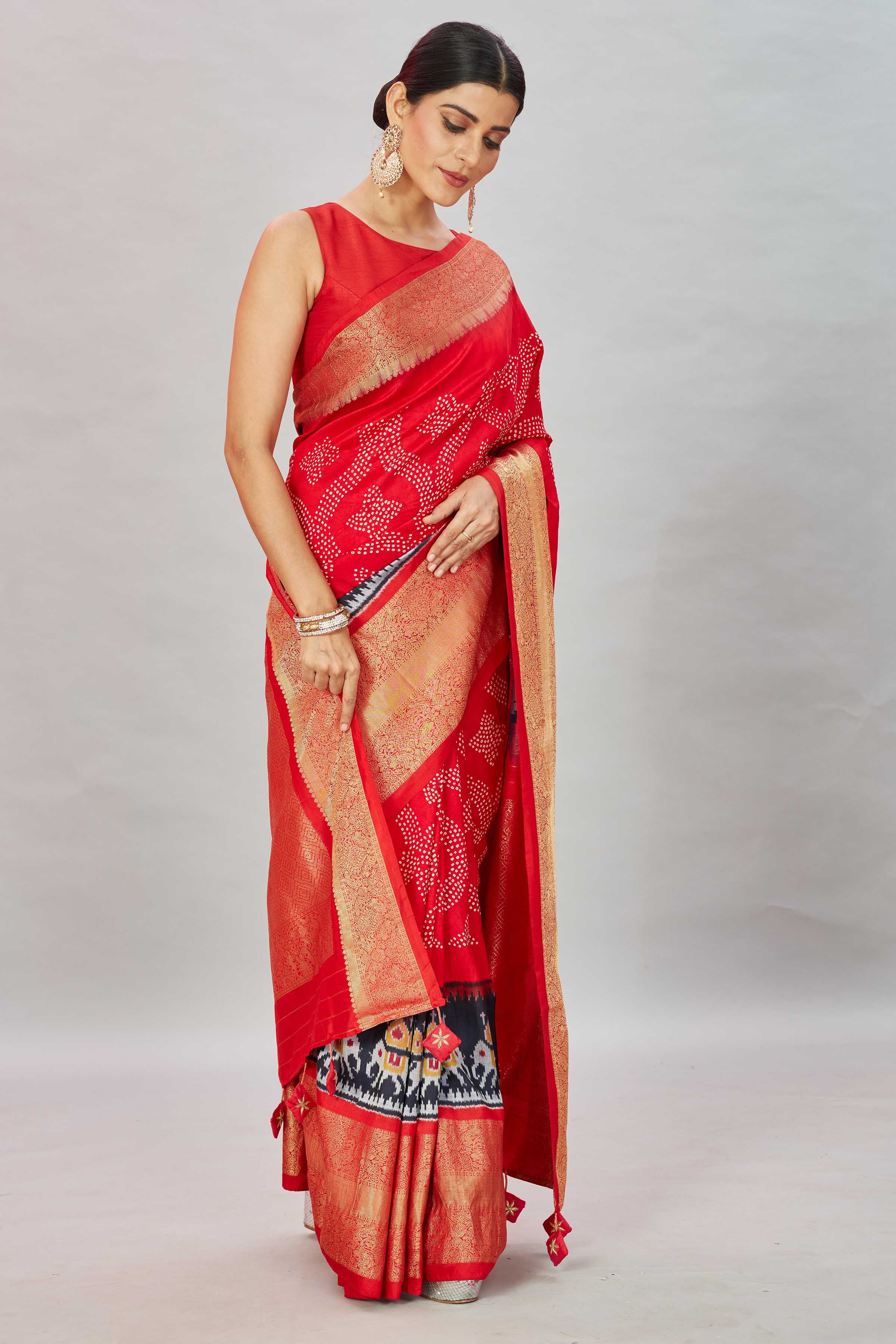 Buy red bandhej Kanjivaram silk saree online in USA with ikkat border. Look your best on festive occasions in latest designer sarees, pure silk sarees, Kanjivaram silk saris, handwoven saris, tussar silk sarees, embroidered saris from Pure Elegance Indian clothing store in USA.-side