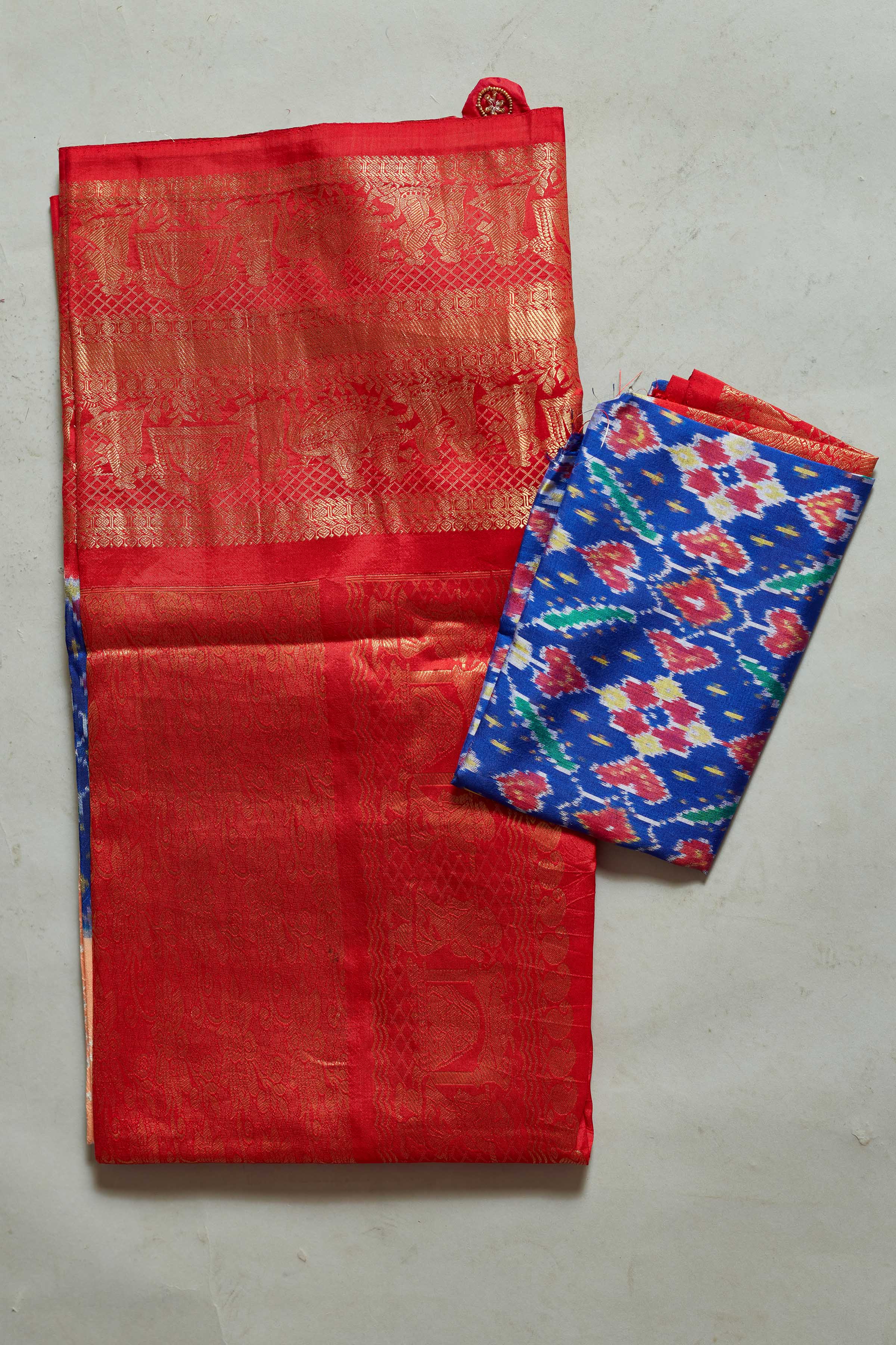 Shop peach bandhej Kanjivaram silk saree online in USA with blue ikkat border. Look your best on festive occasions in latest designer sarees, pure silk sarees, Kanjivaram silk saris, handwoven saris, tussar silk sarees, embroidered saris from Pure Elegance Indian clothing store in USA.-blouse