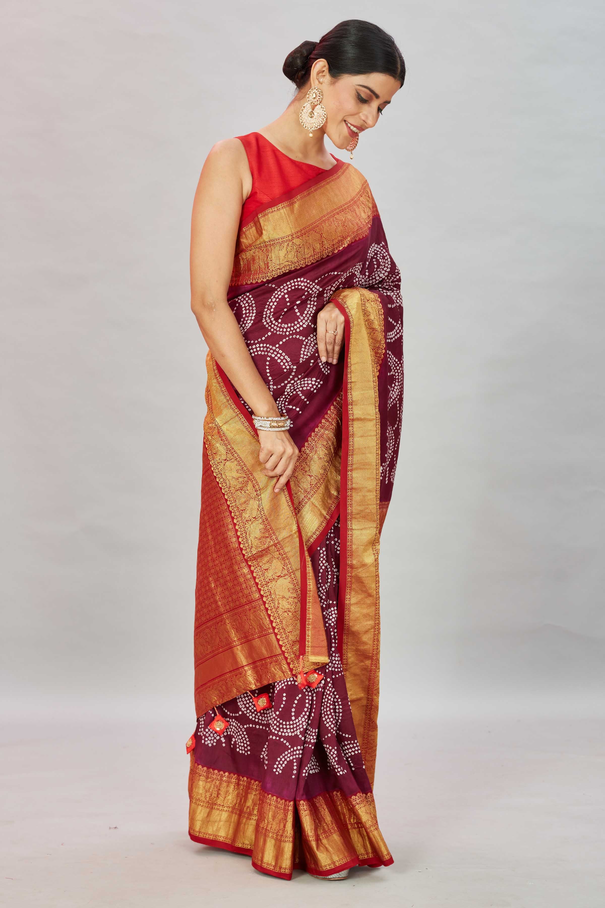 Buy wine color bandhej Kanjivaram silk sari online in USA with zari border. Look your best on festive occasions in latest designer sarees, pure silk sarees, Kanjivaram silk saris, handwoven saris, tussar silk sarees, embroidered saris from Pure Elegance Indian clothing store in USA.-side