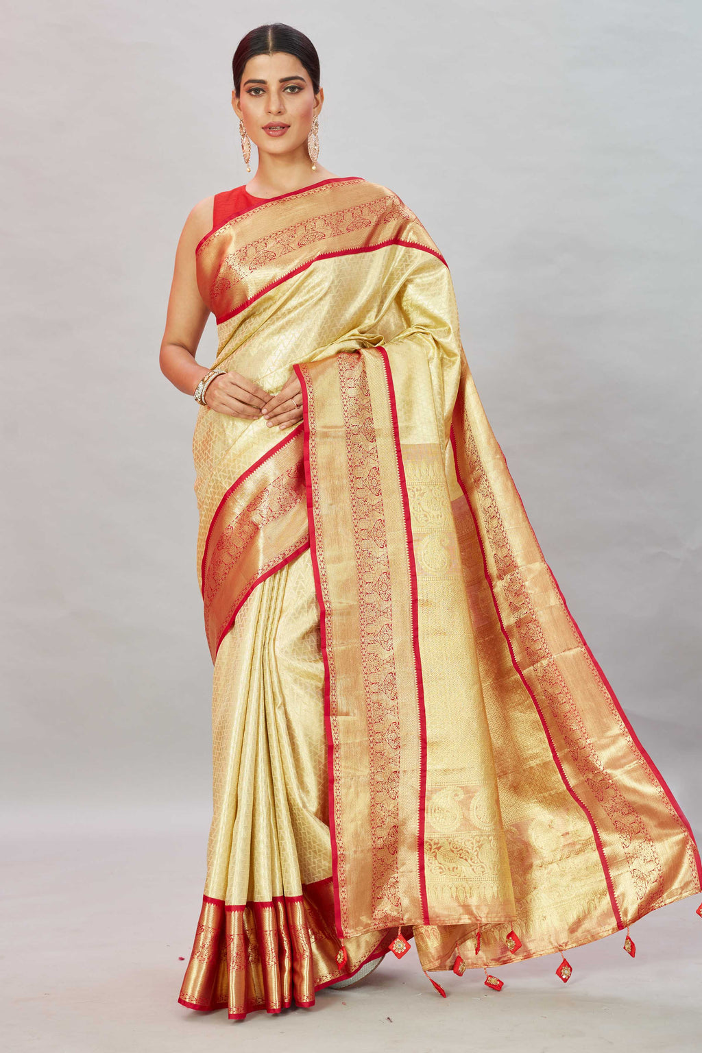 Buy cream Kanjivaram silk sari online in USA with red zari border. Look your best on festive occasions in latest designer sarees, pure silk sarees, Kanjivaram silk saris, handwoven saris, tussar silk sarees, embroidered saris from Pure Elegance Indian clothing store in USA.-full view