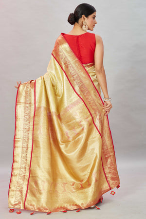 Buy cream Kanjivaram silk sari online in USA with red zari border. Look your best on festive occasions in latest designer sarees, pure silk sarees, Kanjivaram silk saris, handwoven saris, tussar silk sarees, embroidered saris from Pure Elegance Indian clothing store in USA.-back