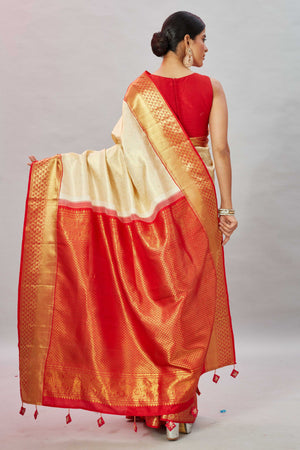 Shop cream Kanjivaram silk saree online in USA with red zari border. Look your best on festive occasions in latest designer sarees, pure silk sarees, Kanjivaram silk saris, handwoven saris, tussar silk sarees, embroidered saris from Pure Elegance Indian clothing store in USA.-back