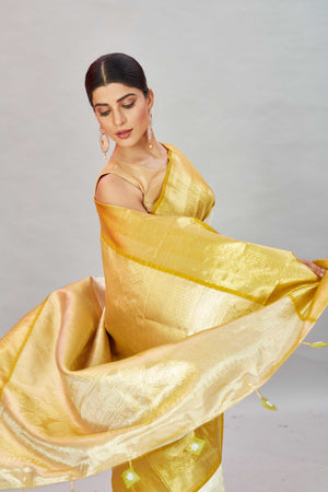Shop cream Kanjivaram silk sari online in USA with golden zari border. Look your best on festive occasions in latest designer sarees, pure silk sarees, Kanjivaram silk saris, handwoven saris, tussar silk sarees, embroidered saris from Pure Elegance Indian clothing store in USA.-closeup