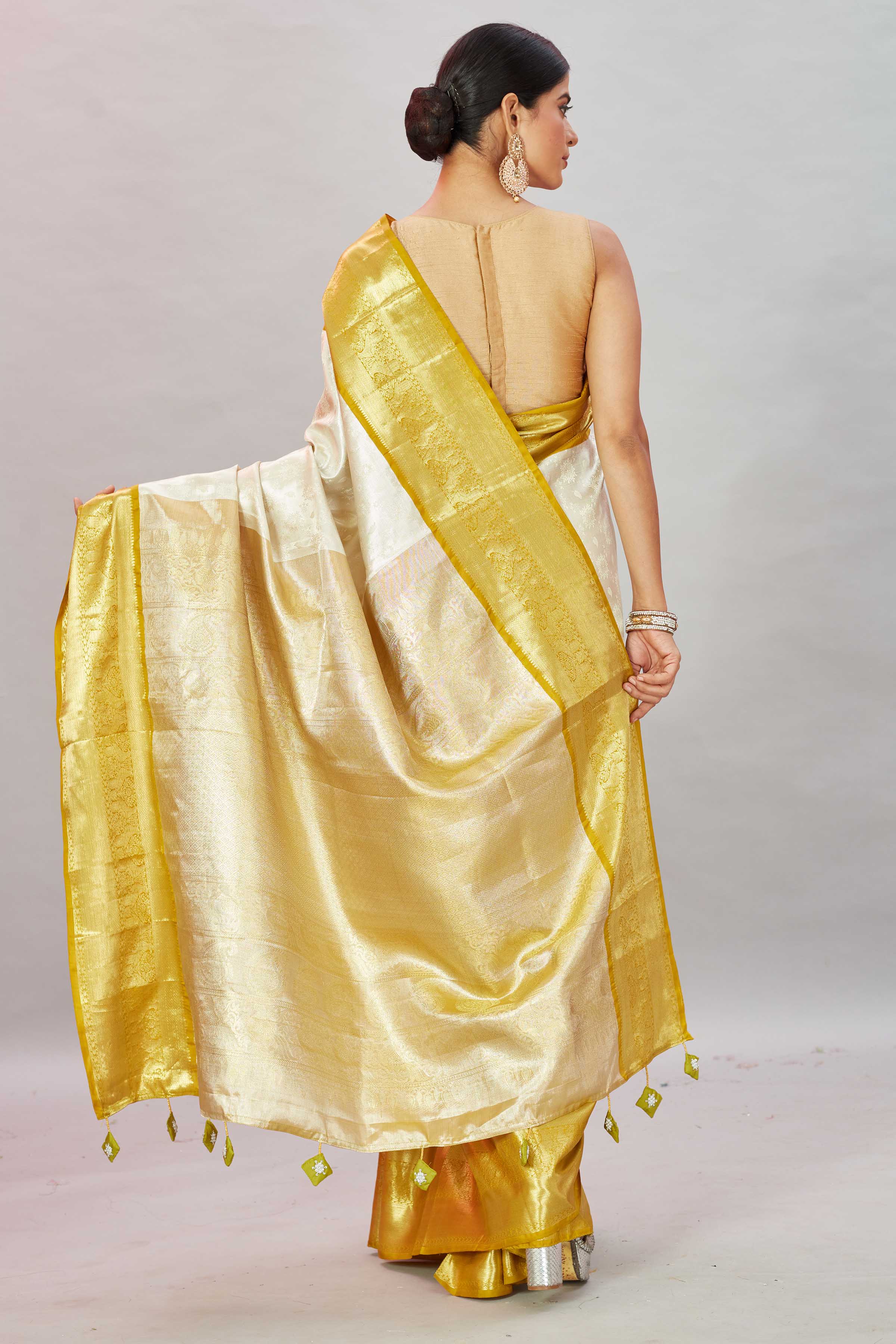Shop cream Kanjivaram silk sari online in USA with golden zari border. Look your best on festive occasions in latest designer sarees, pure silk sarees, Kanjivaram silk saris, handwoven saris, tussar silk sarees, embroidered saris from Pure Elegance Indian clothing store in USA.-back