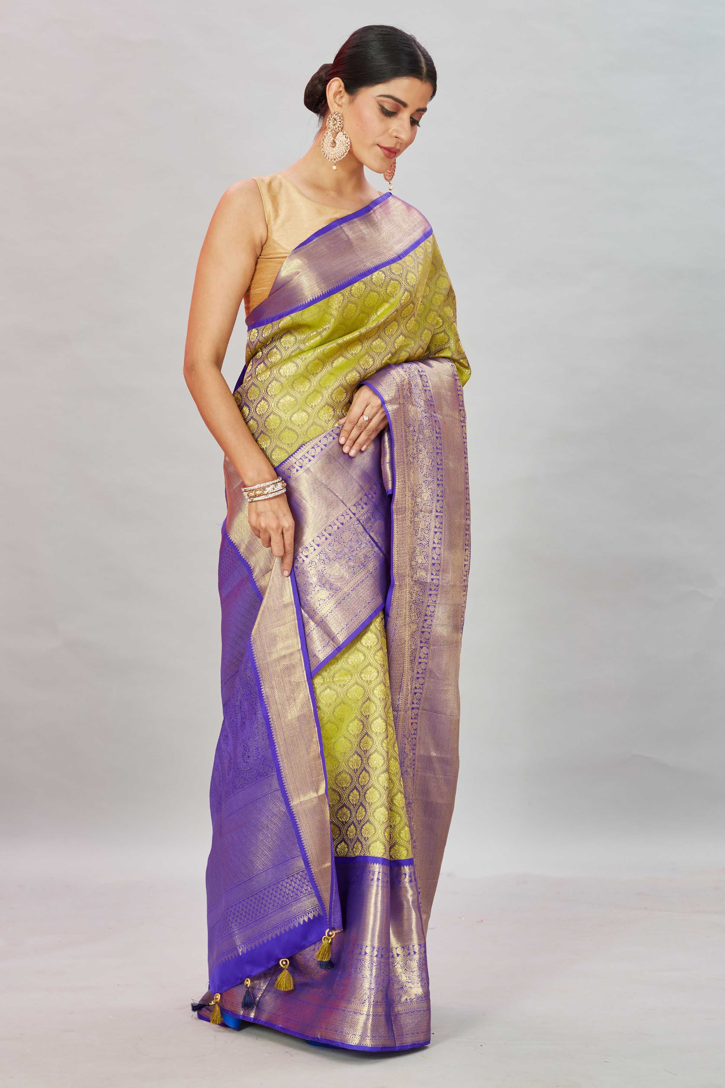 Shop pista  green Kanjivaram silk sari online in USA with purple border. Look your best on festive occasions in latest designer sarees, pure silk sarees, Kanjivaram silk saris, handwoven saris, tussar silk sarees, embroidered saris from Pure Elegance Indian clothing store in USA.-side