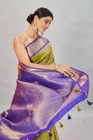 Shop pista  green Kanjivaram silk sari online in USA with purple border. Look your best on festive occasions in latest designer sarees, pure silk sarees, Kanjivaram silk saris, handwoven saris, tussar silk sarees, embroidered saris from Pure Elegance Indian clothing store in USA.-closeup