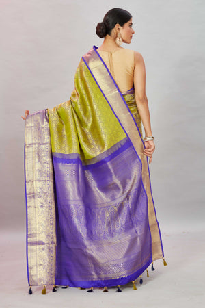 Shop pista  green Kanjivaram silk sari online in USA with purple border. Look your best on festive occasions in latest designer sarees, pure silk sarees, Kanjivaram silk saris, handwoven saris, tussar silk sarees, embroidered saris from Pure Elegance Indian clothing store in USA.-back