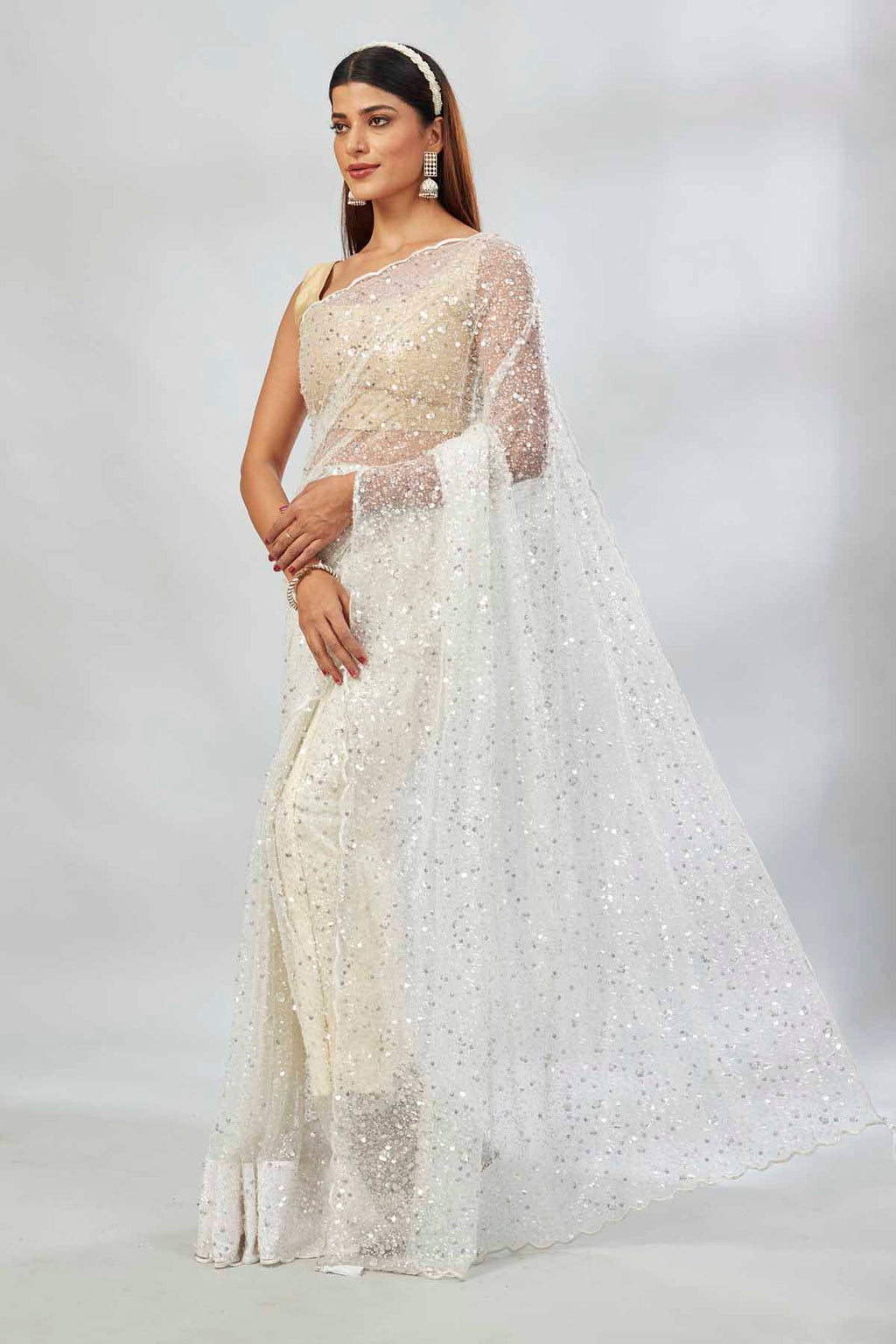 Shop white designer net sari online in USA with overall embroidery. Look your best on festive occasions in latest designer saris, pure silk saris, Kanjivaram silk sarees, handwoven saris, tussar silk sarees, linen sarees,  embroidered sarees from Pure Elegance Indian clothing store in USA.-full view