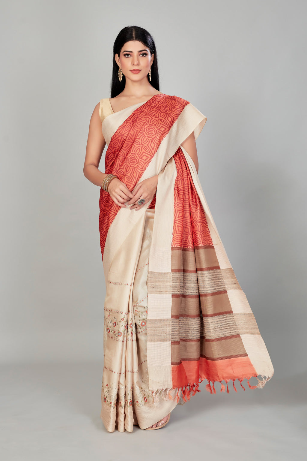 Shop orange and cream embroidered tussar silk saree online in USA. Shop designer sarees, tussar silk sarees, Kanjivaram sarees from Indian saree store in USA.-full view