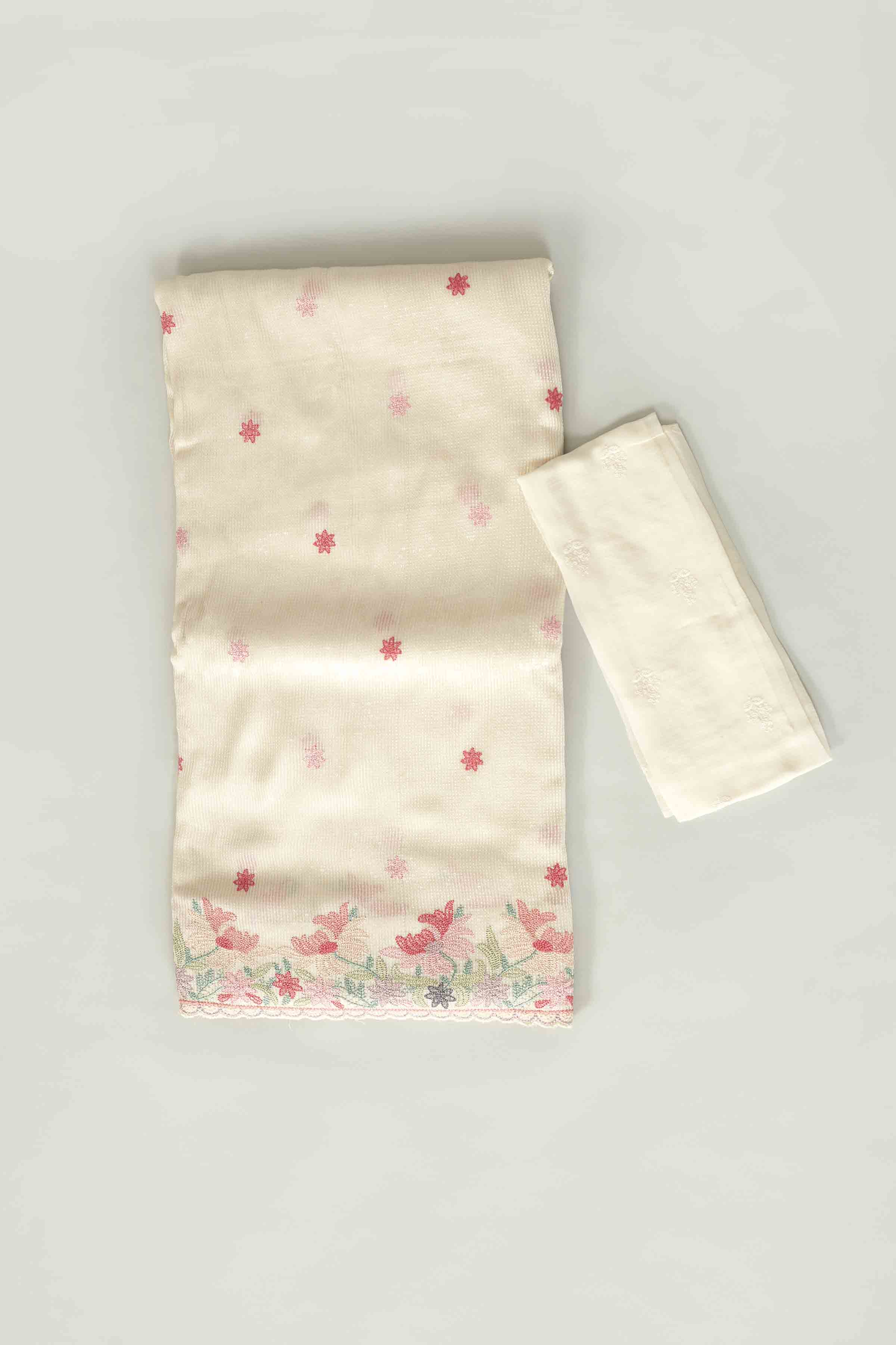 Shop cream tissue sari online in USA with embroidered border and buti. Look your best on festive occasions in latest designer saris, pure silk saris, tissue silk sarees, handwoven saris, tussar silk sarees, linen sarees,  summer sarees from Pure Elegance Indian clothing store in USA.-closeup