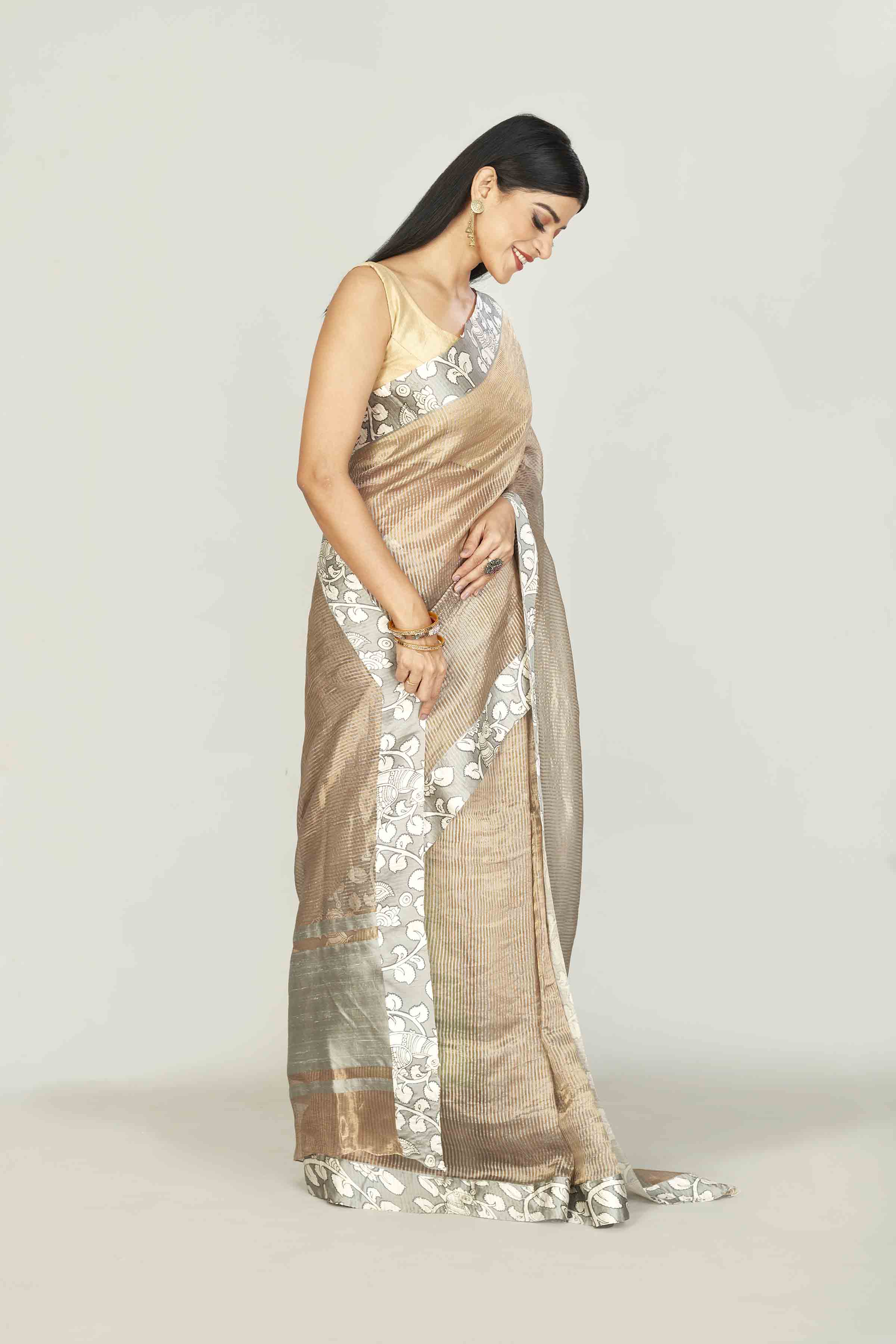 Shop beige tissue silk saree online in USA with printed border. Look your best on festive occasions in latest designer saris, pure silk saris, tissue silk sarees, handwoven saris, tussar silk sarees, linen sarees,  summer sarees from Pure Elegance Indian clothing store in USA.-side
