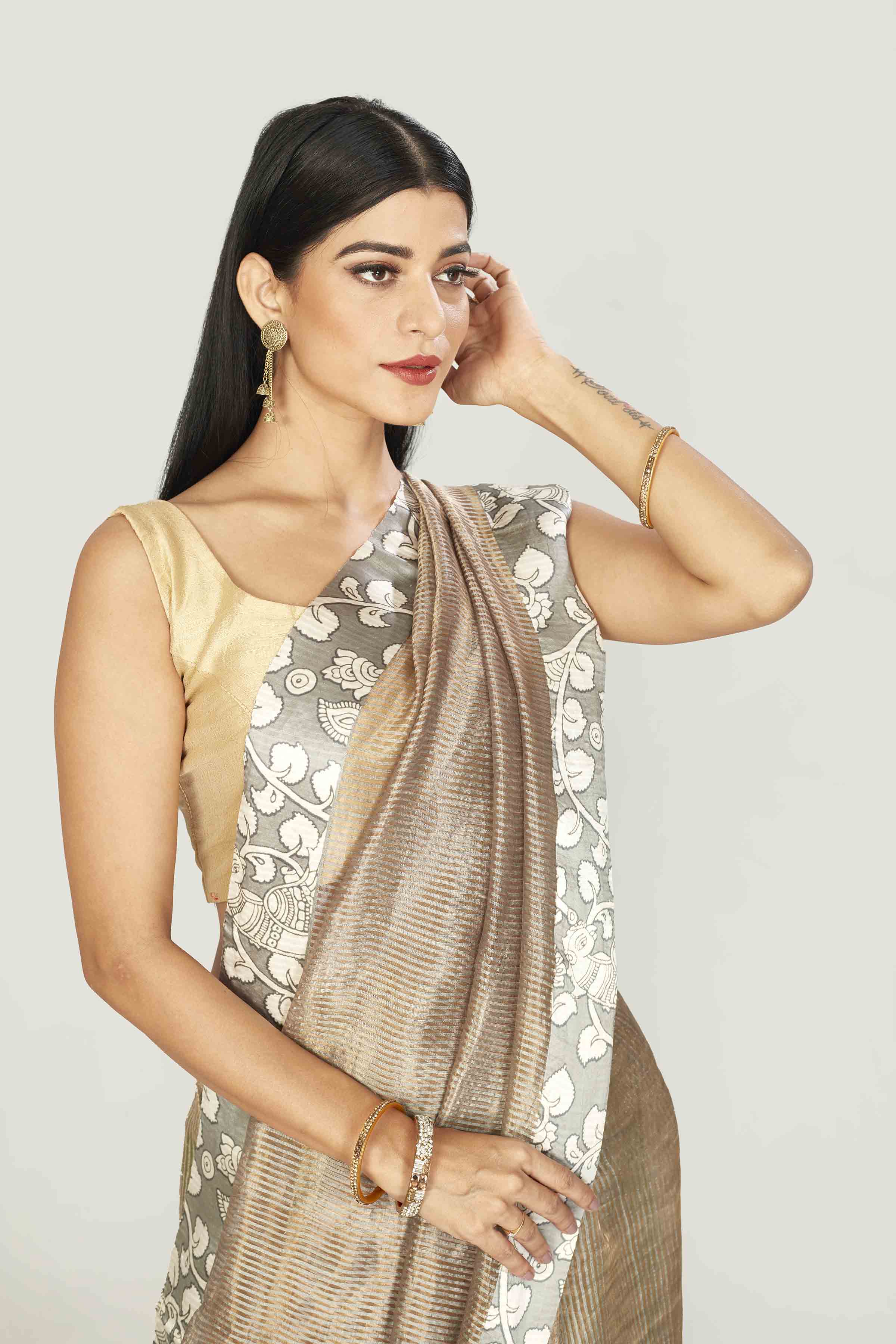 Shop beige tissue silk saree online in USA with printed border. Look your best on festive occasions in latest designer saris, pure silk saris, tissue silk sarees, handwoven saris, tussar silk sarees, linen sarees,  summer sarees from Pure Elegance Indian clothing store in USA.-closeup