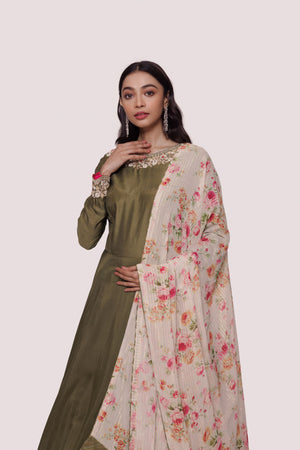 Shop beautiful olive green muslin Anarkali suit online in USA with georgette dupatta. Shop the best and latest designs in embroidered sarees, designer sarees, Anarkali suit, lehengas, sharara suits for weddings and special occasions from Pure Elegance Indian fashion store in USA.-closeup