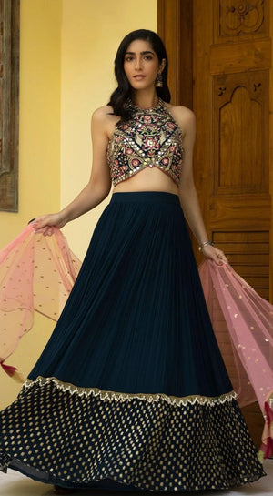 Shop navy blue mirror work lehenga online in USA with pink dupatta. Shop bridal lehengas, designer sarees, bridesmaids lehengas, designer salwar suits, wedding lehengas, wedding sarees in USA from Pure Elegance Indian fashion clothing store.-front