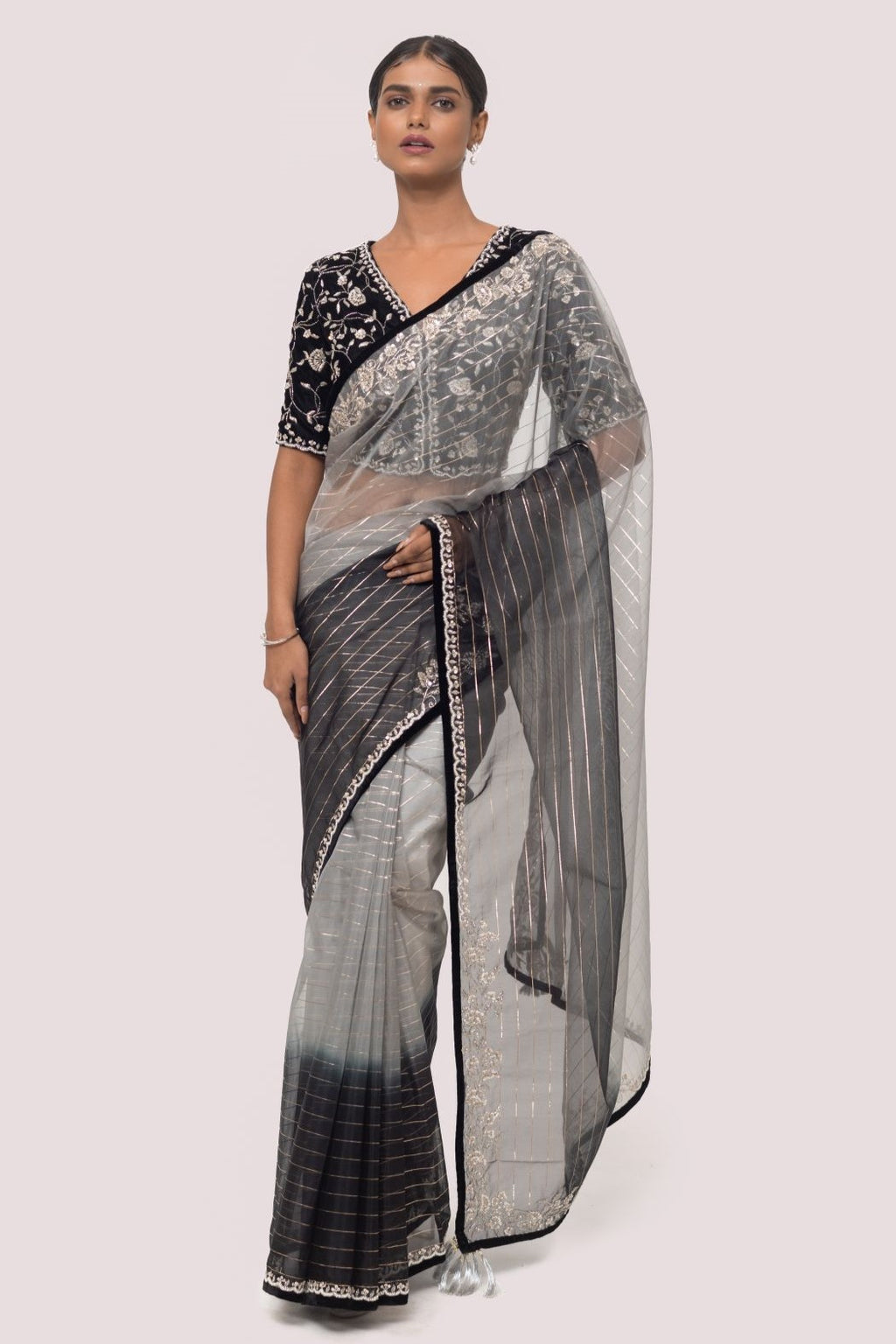 Shop grey and black dual saree set with an embroidered black blouse. Make a fashion statement on festive occasions and weddings with designer sarees, designer suits, Indian dresses, Anarkali suits, palazzo suits, designer gowns, sharara suits, and embroidered sarees from Pure Elegance Indian fashion store in the USA.