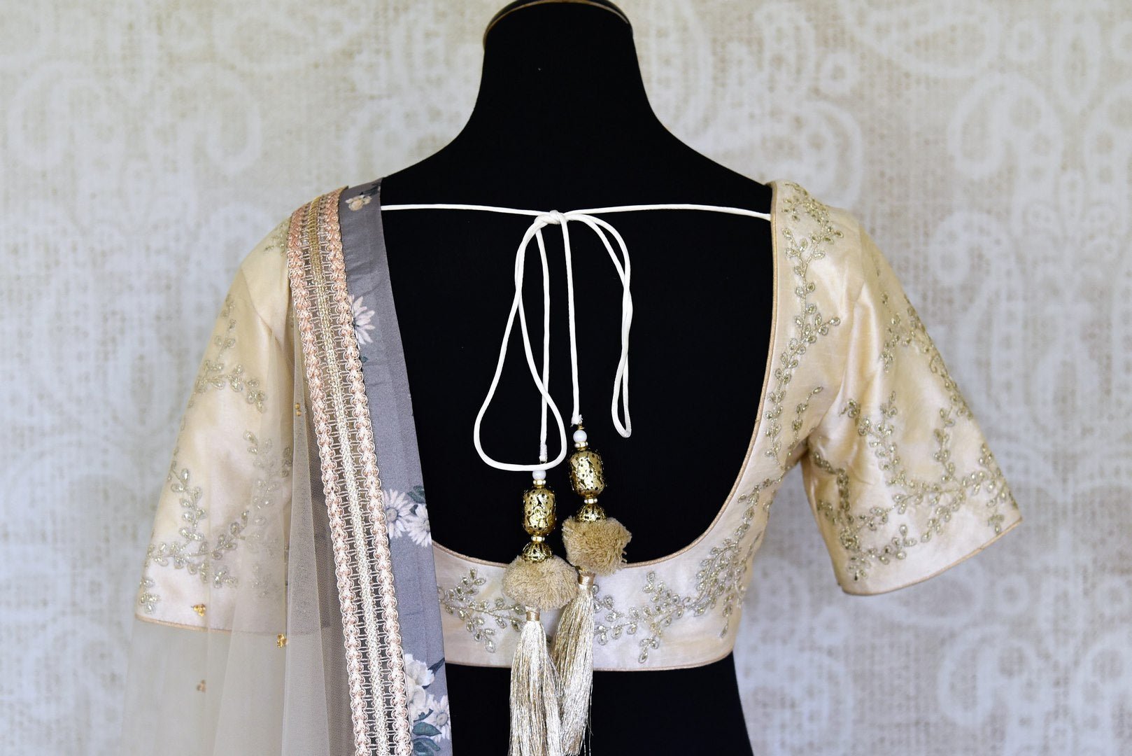 Shop grey and cream printed embroidered lehenga online in USA with dupatta. Get ready to dazzle on weddings and special occasions with an exquisite variety of Indian designer clothes from Pure Elegance Indian clothing store in USA. We have a splendid collection of bridal lehengas, designer sarees, Anarkali suits to make your look absolutely one of kind.-back
