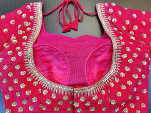 Buy stunning pink saree blouse online in USA with embroidered flowers. Elevate your ethnic sari style with a stunning collection of designer sari blouses, embroidered saree blouses, Banarasi sari blouse, fancy sari blouse from Pure Elegance Indian clothing store in USA.-back
