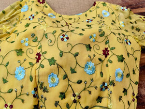 Buy beautiful yellow embroidered designer saree blouse online in USA with sheer sleeves. Elevate your ethnic saree style with a tasteful collection of designer sari blouses, embroidered saree blouses, Banarasi blouse, silk sari blouse from Pure Elegance Indian clothing store in USA.-back