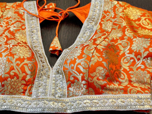 Buy  beautiful orange zari work sari blouse online in USA with embroidered lace. Elevate your ethnic sari style with a stunning collection of designer saree blouses, embroidered saree blouses, Banarasi sari blouse, silk sari blouse from Pure Elegance Indian clothing store in USA.-front
