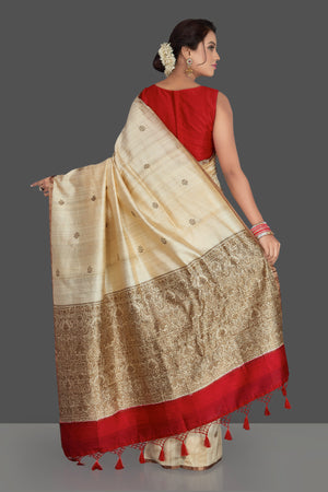 Shop elegant cream Banarasi silk sari online in USA with antique zari pallu. Keep it elegant with handwoven sarees, Banarasi silk sarees, soft silk sarees from Pure Elegance Indian fashion boutique in USA. We bring a especially curated collection of ethnic sarees for Indian women in USA under one roof!-back