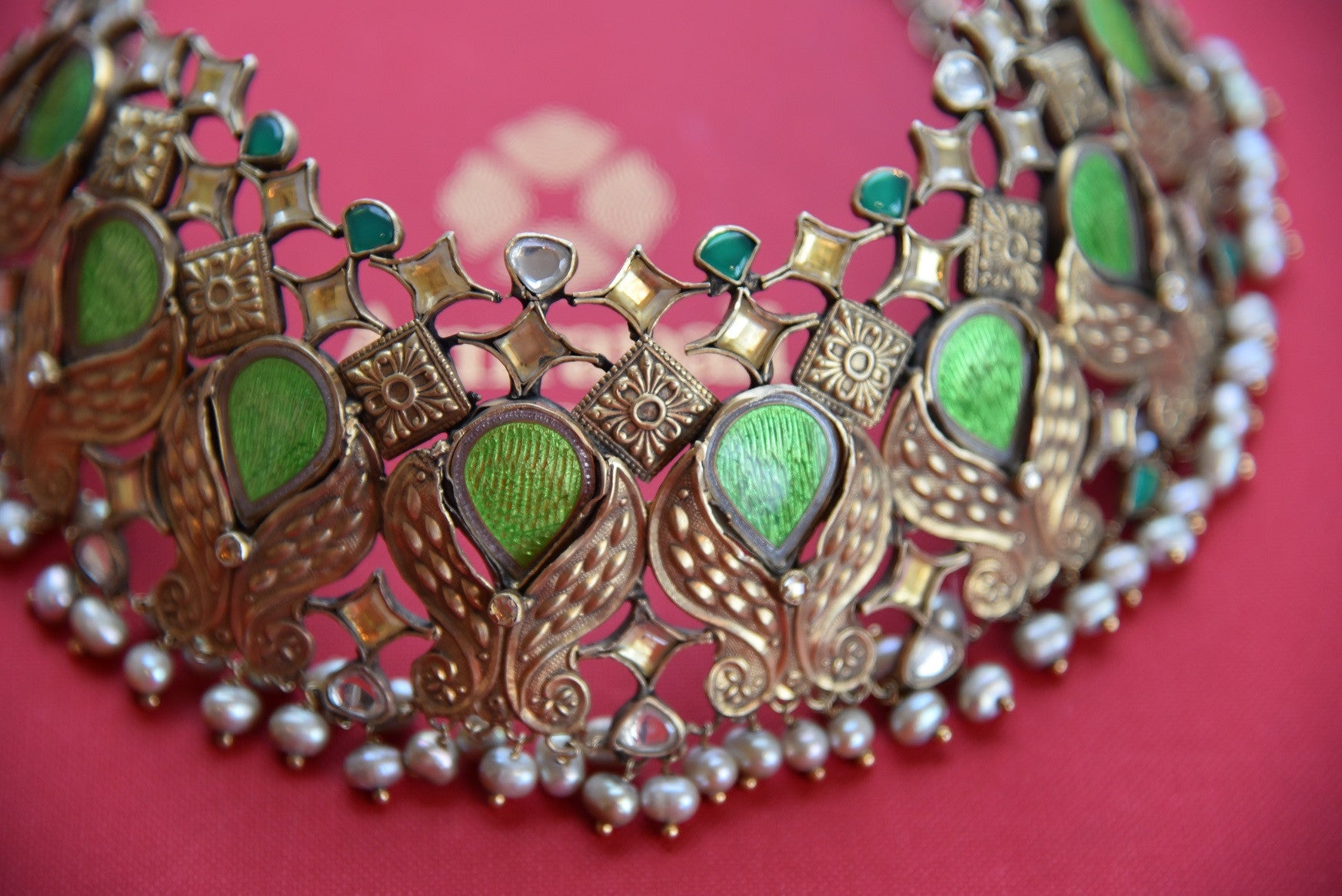 Shop this captivating chunky green and silver fashion jewelry necklace online or from our store near NYC. It is perfect for any wedding, reception, sangeet or reception party.  Close up.