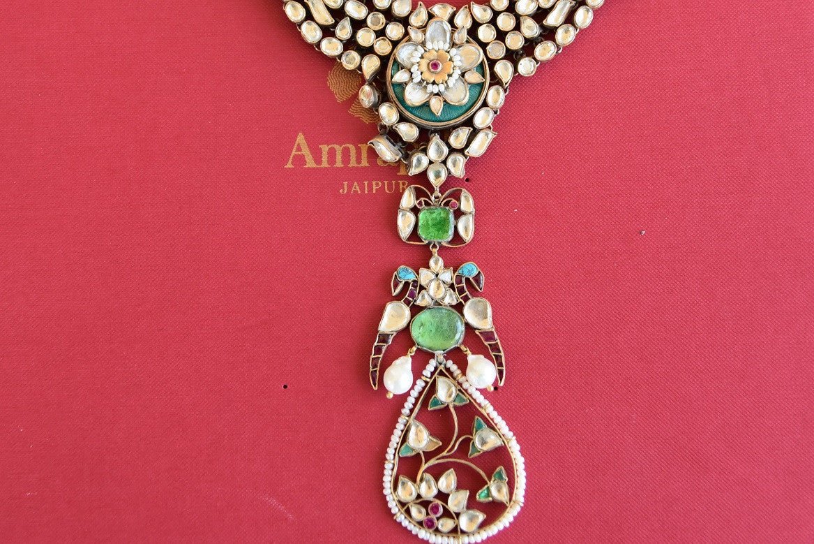 Ethnic as well as classy designer silver gold plated fashion necklace with white and green glass and pearls.- details