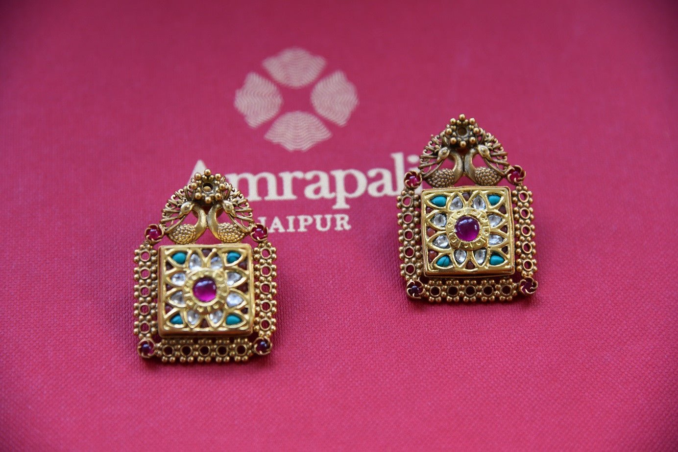 Shop this traditional Indian green and silver gold plated glass amrapali earrings from Pure Elegance online or from our store in USA. Perfect for any wedding, reception or sangeet. Earrings.