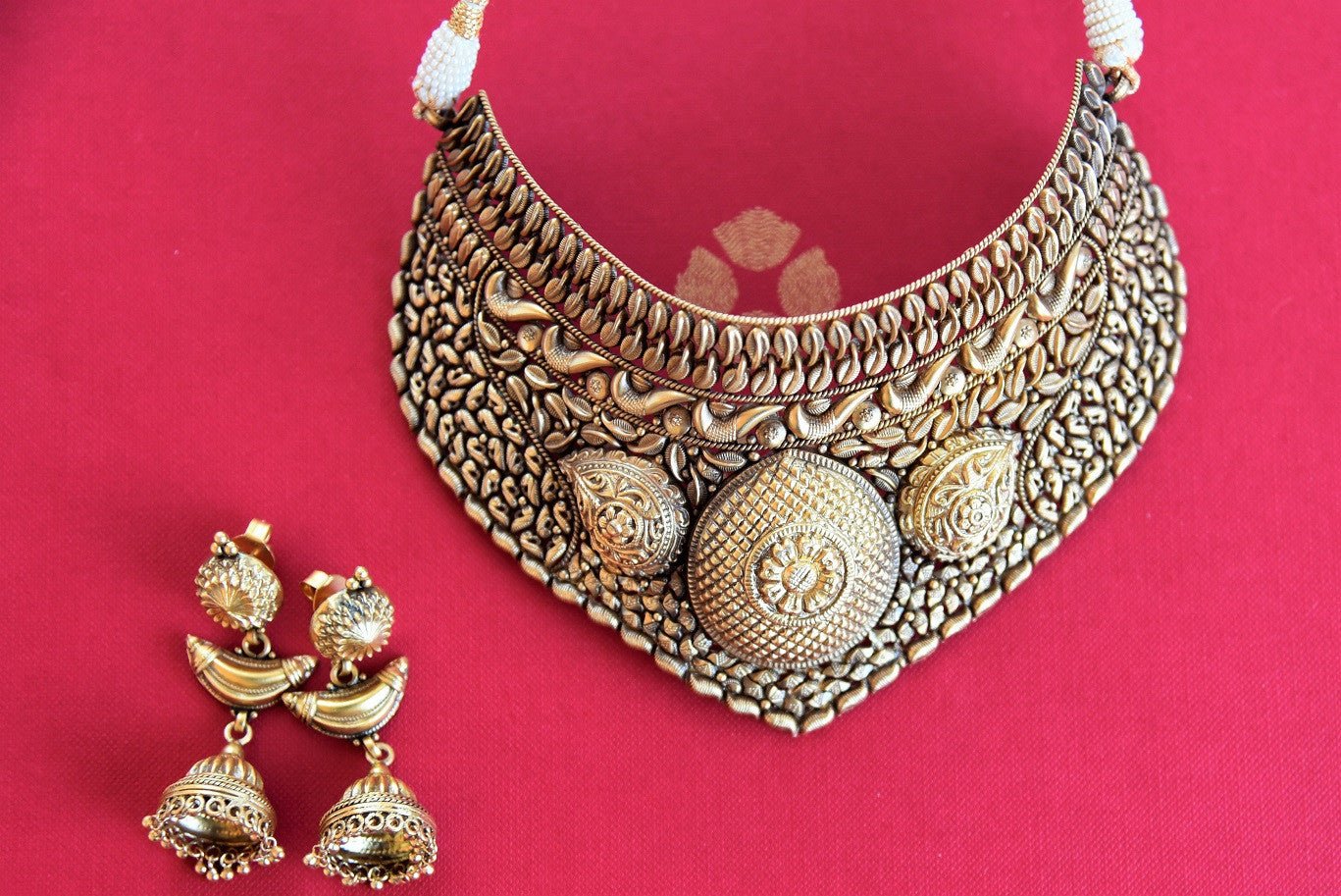 Detailed silver gold plated textured flower dome filigree choker necklace with moon shaped added jhumka earrings . Perfect in wedding parties.- Full View