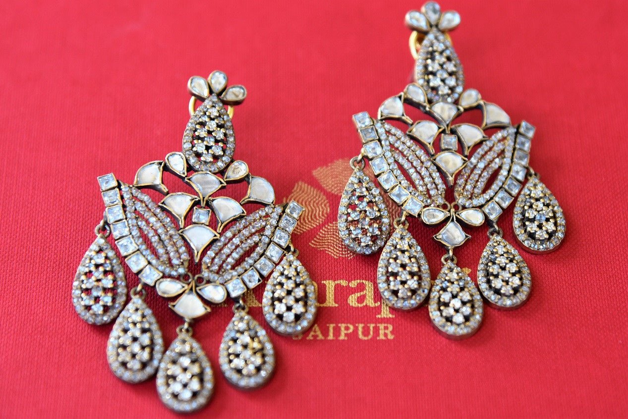 Buy Stylish Silver Gold Plated Zircon Chandelier Earrings online from Pure Elegance store. Browse through an exquisite range of Indian earrings online in USA to pick your favorite.-closeup