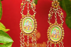 Buy Amrapali silver gold plated radha krishna earrings online in USA. Pure Elegance fashion store brings an exquisite collection of ethnic Indian silver jewelry in USA. -closeup