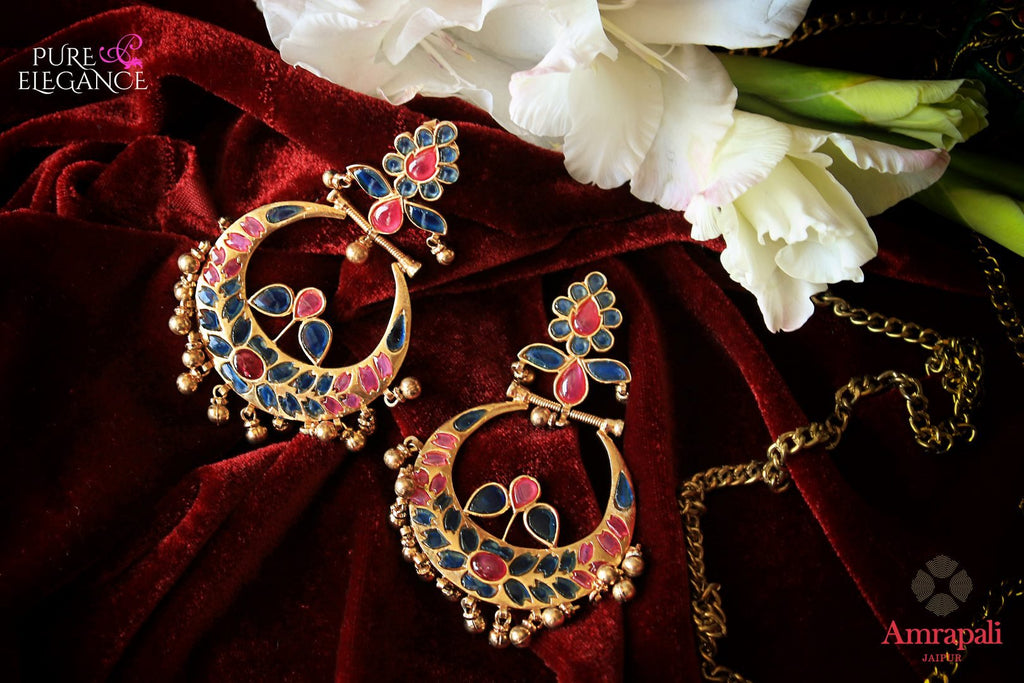 Buy beautiful silver gold plated pink and blue glass chandbali earrings online in USA from Amrapali. The earrings are an alluring match to traditional Indian attires at weddings. Shop more such gorgeous Indian silver gold plated earrings in USA at Pure Elegance, you can visit our exclusive fashion store in USA or shop online.-flatlay